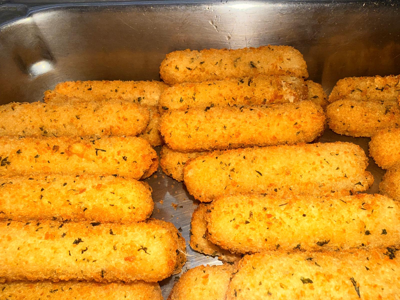 Steam-table with curries, rice, and sides